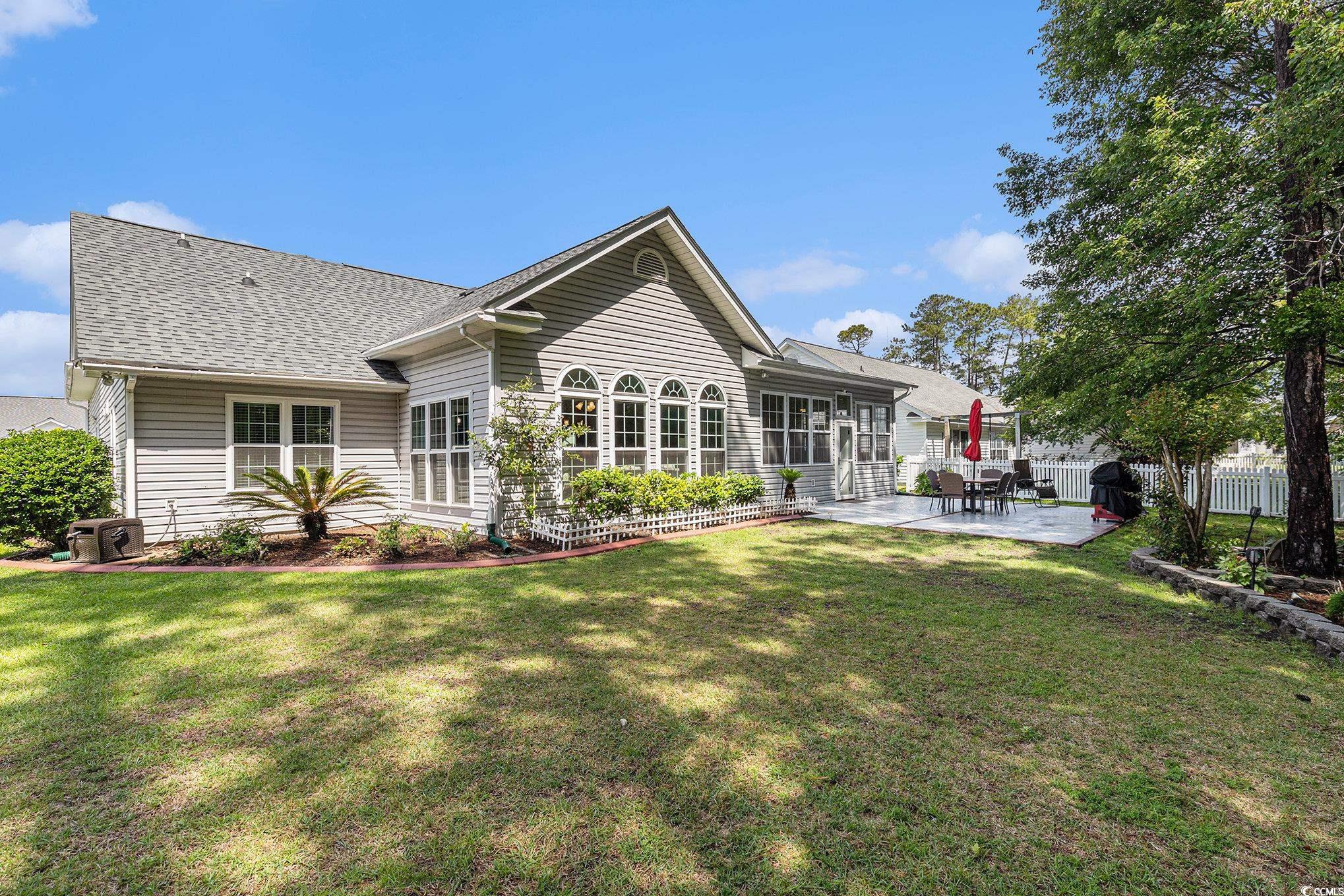 1105 Lampwick Lane Murrells Inlet, SC 29576 - Photo 38 of 40 Rear view of house featuring a patio area and a shingled roof