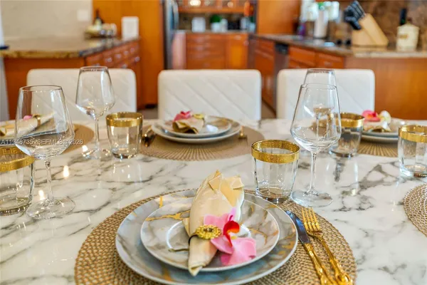 a dining room with furniture and wooden floor