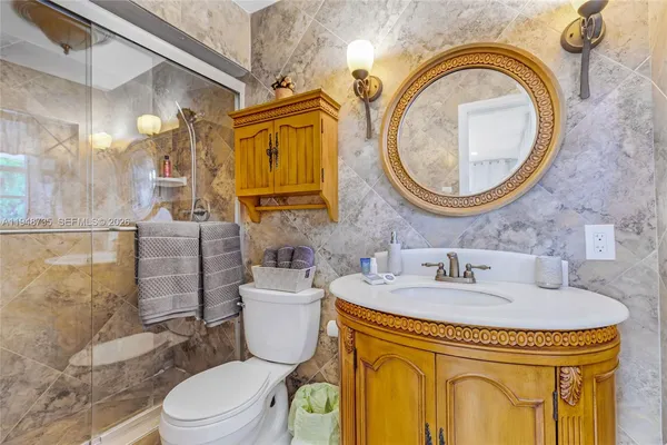 a view of a house with swimming pool and sitting area