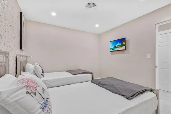 a view of a fountain in the back yard of the house