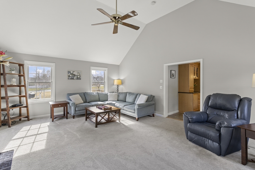 66 Clover Hill Circle Tyngsborough, MA 01879 - Photo 13 of 42 a living room with furniture and a window