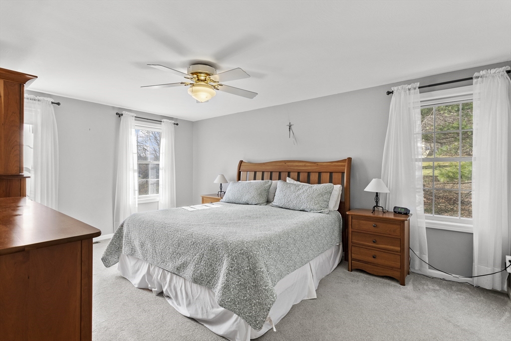 66 Clover Hill Circle Tyngsborough, MA 01879 - Photo 21 of 42 a bedroom with a bed and a window