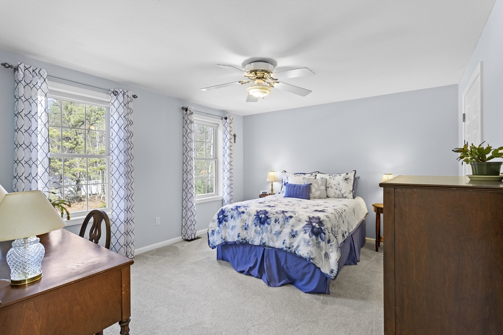 66 Clover Hill Circle Tyngsborough, MA 01879 - Photo 28 of 42 a bedroom with bed and window