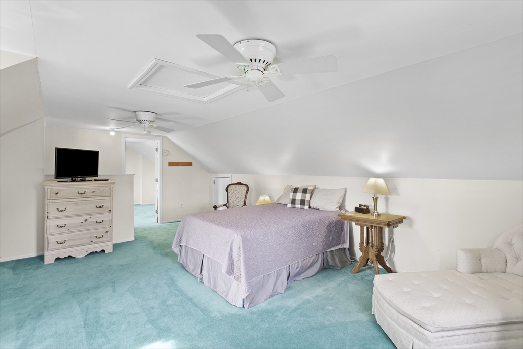 66 Clover Hill Circle Tyngsborough, MA 01879 - Photo 31 of 42 a bedroom with a bed and a flat screen tv