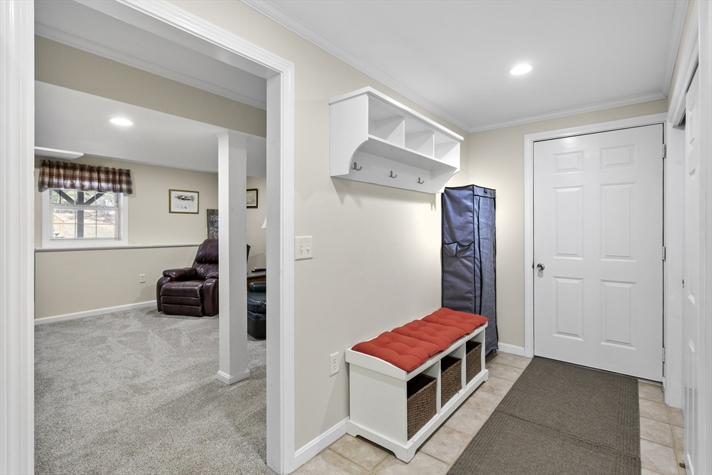 66 Clover Hill Circle Tyngsborough, MA 01879 - Photo 33 of 42 a room with furniture and a gate