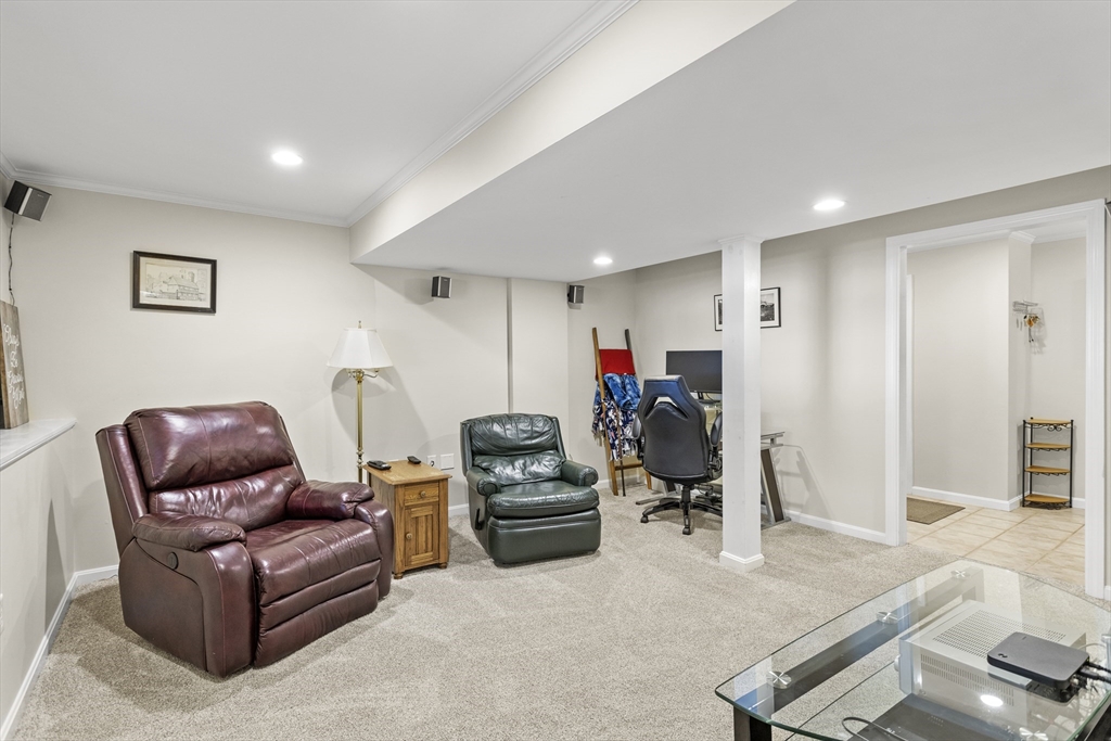 66 Clover Hill Circle Tyngsborough, MA 01879 - Photo 34 of 42 a living room with furniture