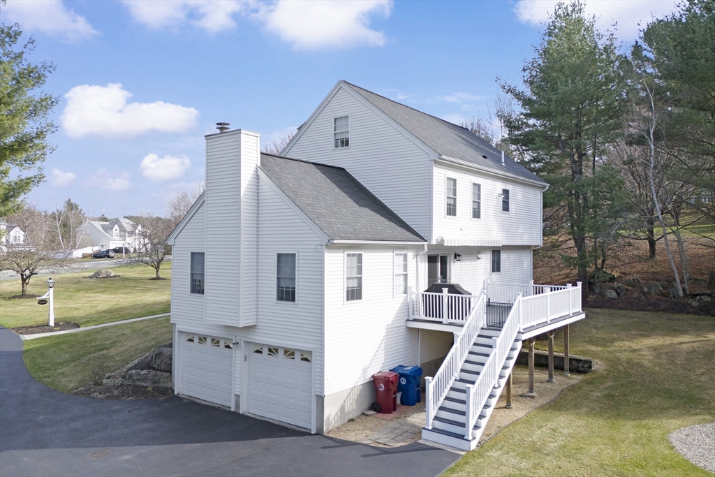 66 Clover Hill Circle Tyngsborough, MA 01879 - Photo 39 of 42 a view of a house with a patio