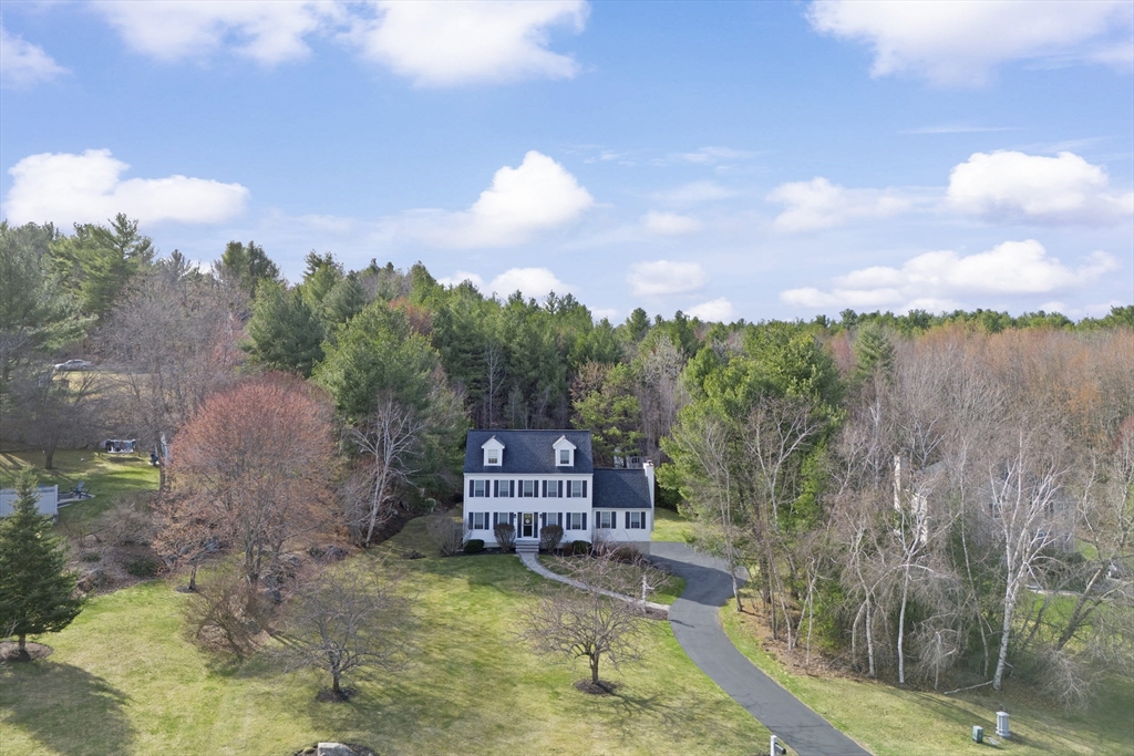 66 Clover Hill Circle Tyngsborough, MA 01879 - Photo 40 of 42 a view of a water with iron fence