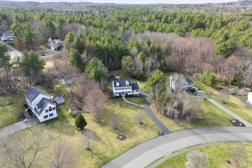 66 Clover Hill Circle Tyngsborough, MA 01879 - Photo 41 of 42 an aerial view of a house with a yard