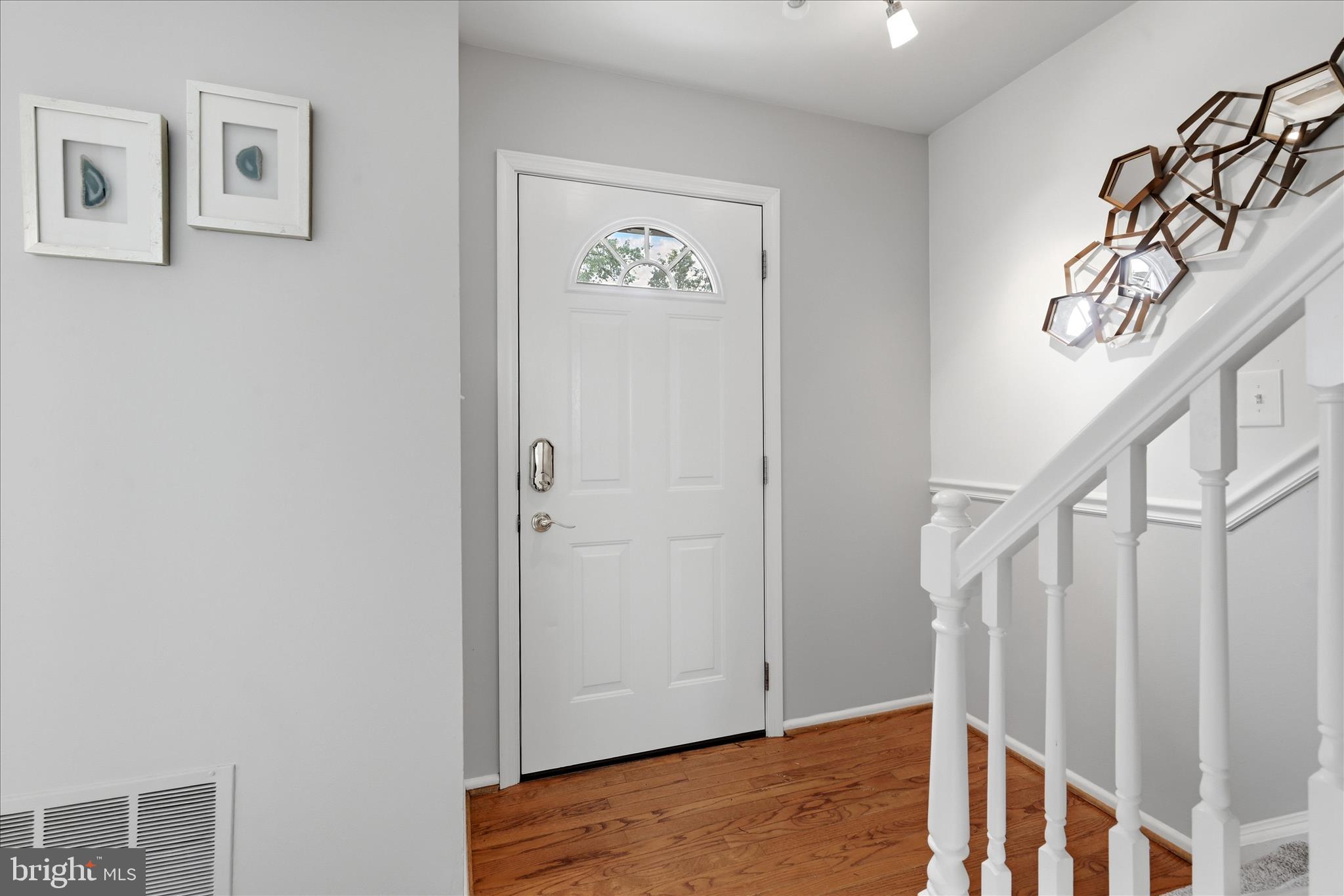 5446 Lighthouse Lane Burke, VA 22015 - Photo 27 of 36 a view of an entryway with wooden floor