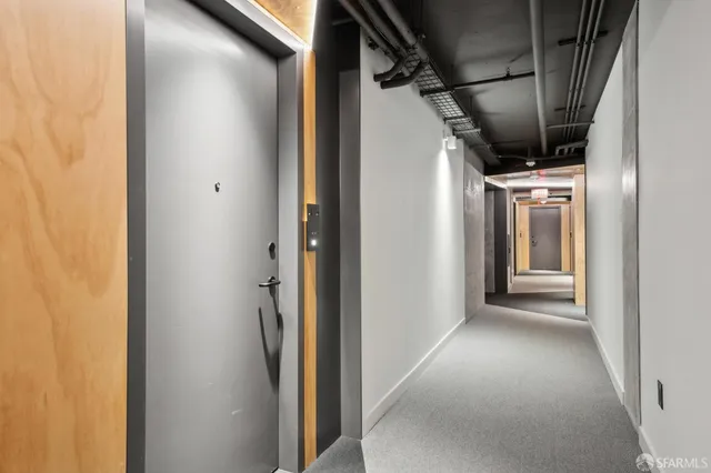 a view of a bathroom from a hallway