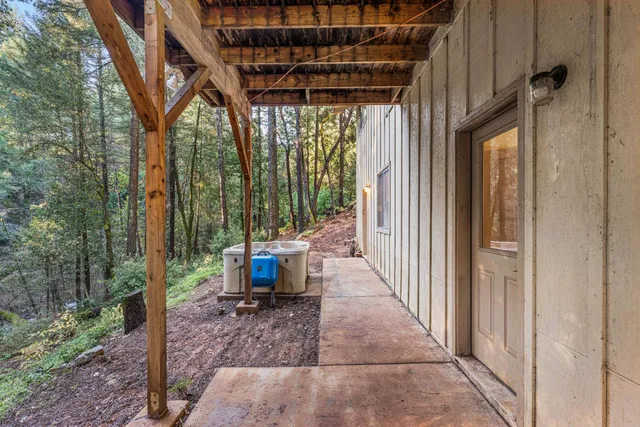 a bedroom with furniture and a closet