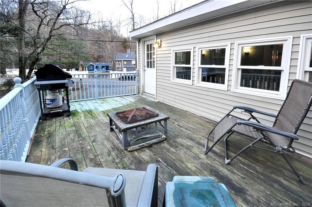 45 Barkhamsted Road Granby, CT 06090 - Photo 35 of 35 a backyard of a house with barbeque oven table and chairs