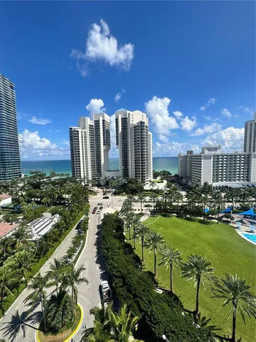 a view of swimming pool outdoor seating and city view