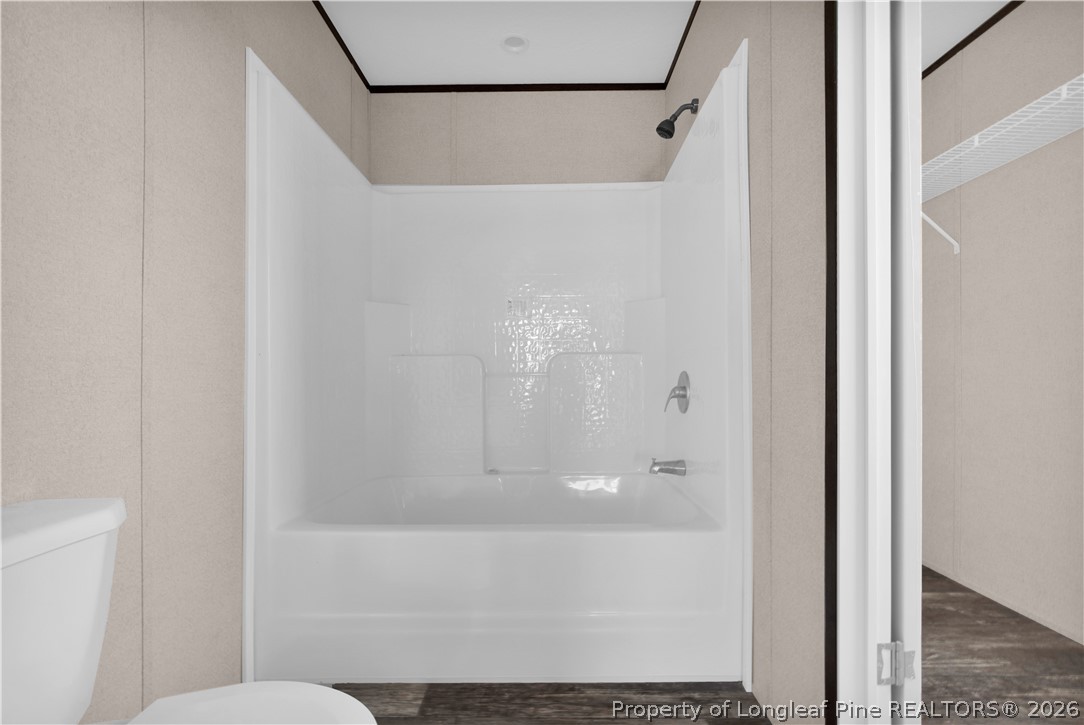 6309 Deep Branch Road Pembroke, NC 28372 - Photo 18 of 32 a bathroom with a shower and a toilet