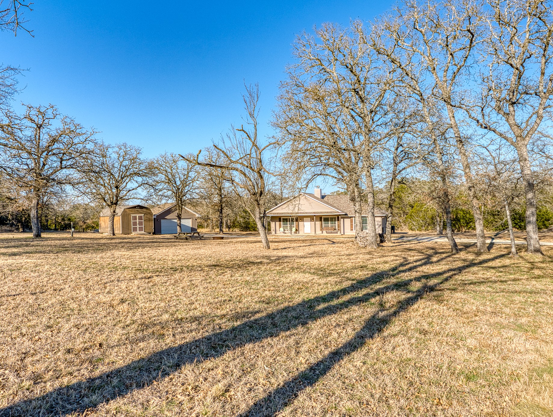 489 Nordic Ridge Road Bertram, TX 78605 - Photo 14 of 19 View of green lawn featuring an outbuilding