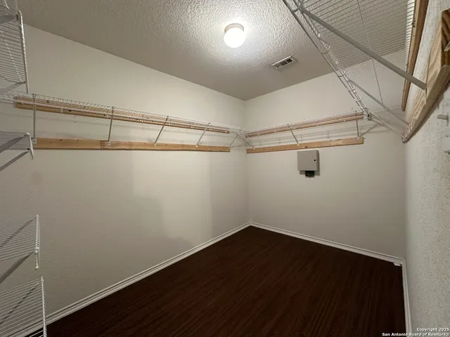 a view of a room with racks on the wall