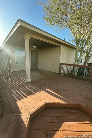 a view of backyard with wooden deck