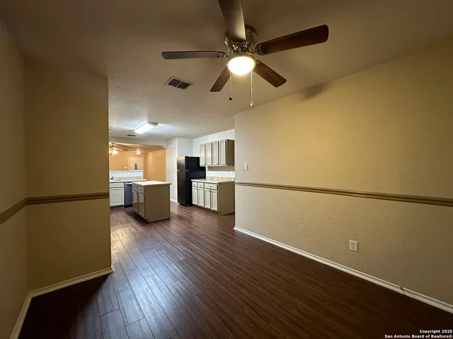 a view of a kitchen with a microwave and a stove top oven