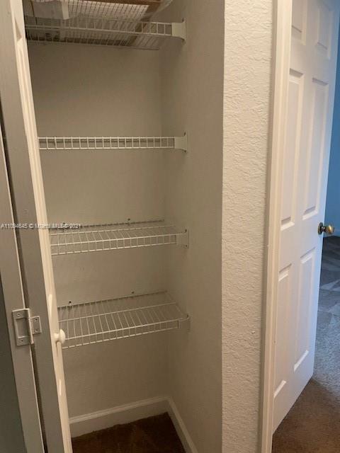 Oasis Homestead, FL 33033 - Photo 14 of 37 a view of a room with racks on the wall