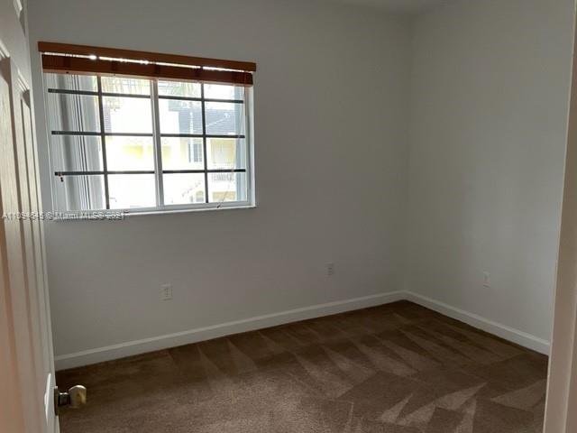 Oasis Homestead, FL 33033 - Photo 15 of 37 an empty room with a window