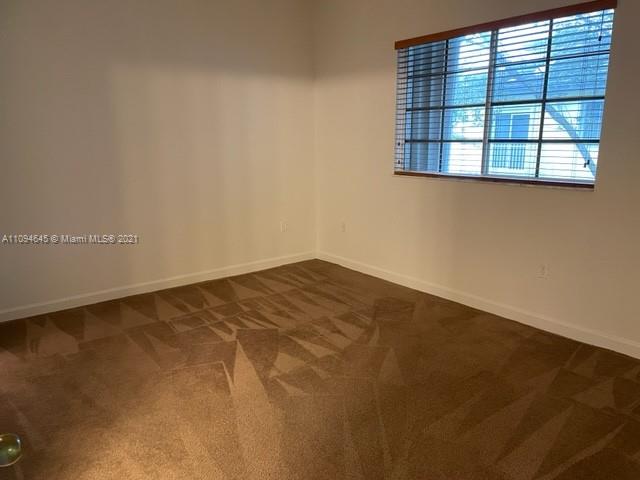 Oasis Homestead, FL 33033 - Photo 18 of 37 an empty room with a window