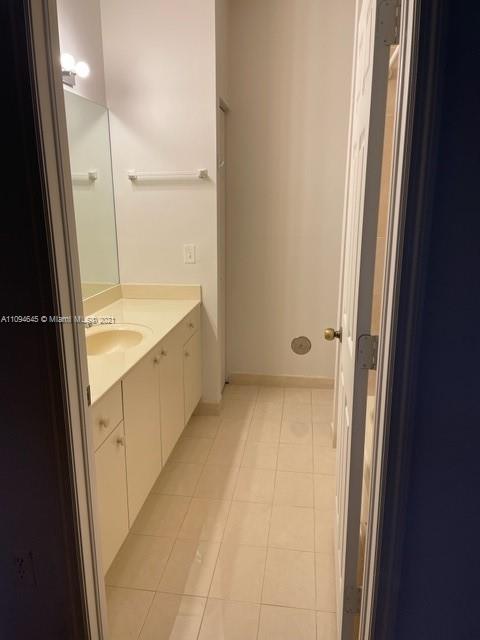 Oasis Homestead, FL 33033 - Photo 19 of 37 a bathroom with a tub sink and mirror