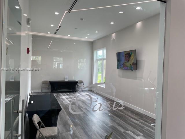 Oasis Homestead, FL 33033 - Photo 26 of 37 a living room with furniture and a flat screen tv