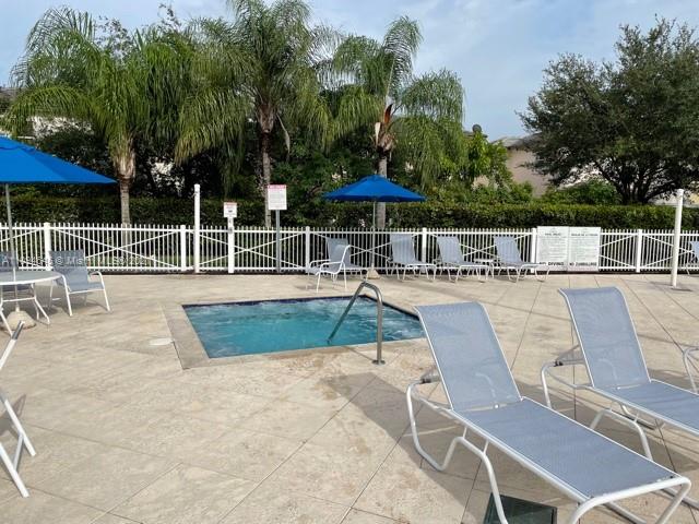 Oasis Homestead, FL 33033 - Photo 31 of 37 swimming pool view with a seating space