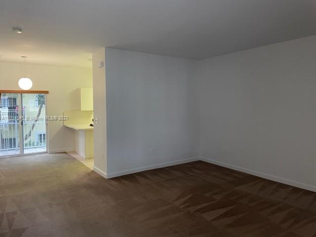 Oasis Homestead, FL 33033 - Photo 5 of 37 a view of a room with a empty space and a sink