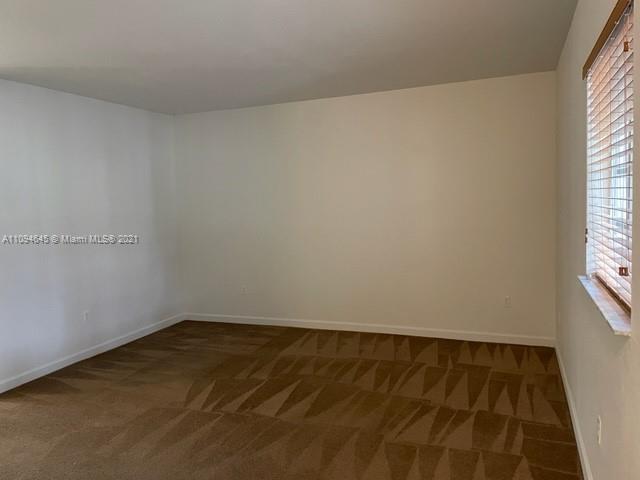 Oasis Homestead, FL 33033 - Photo 6 of 37 an empty room with a window