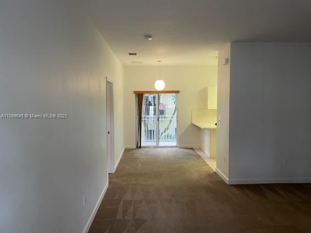 Oasis Homestead, FL 33033 - Photo 7 of 37 a view of a big room with wooden floor and windows