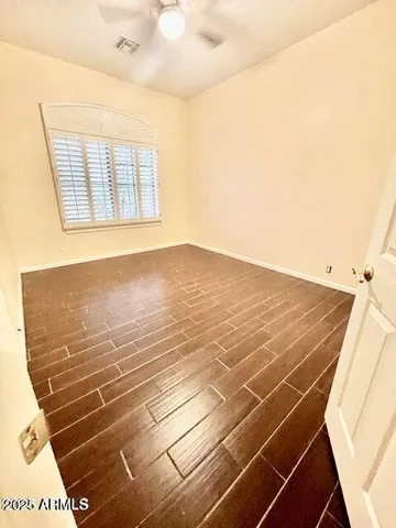 a view of an empty room with windows