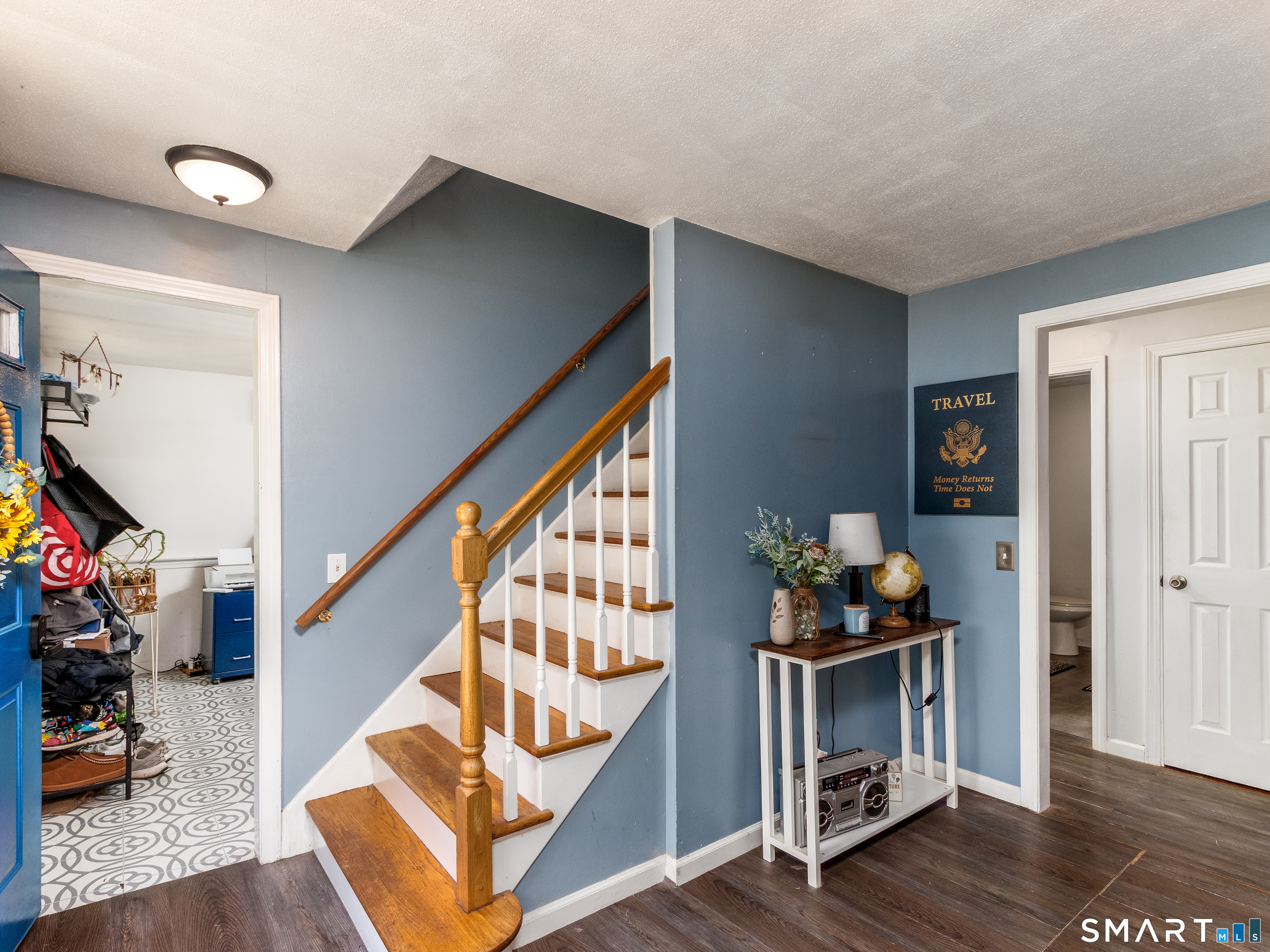 15 Bluff Avenue Clinton, CT 06413 - Photo 11 of 38 a living room with wooden floor and stairs