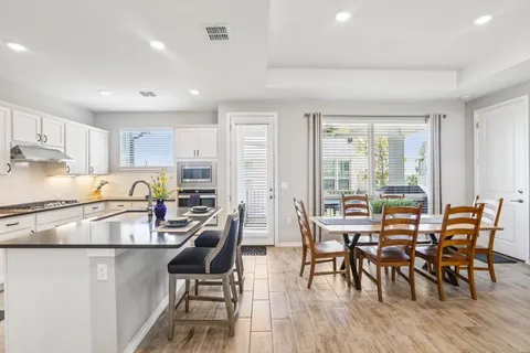 a view of a dining room with furniture window and outside view