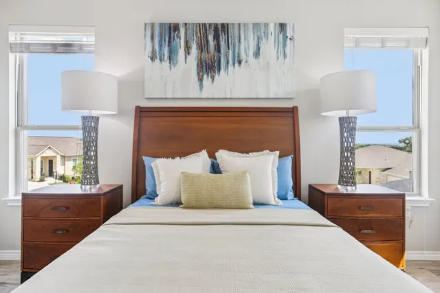 a dining hall with stainless steel appliances granite countertop a sink and a refrigerator