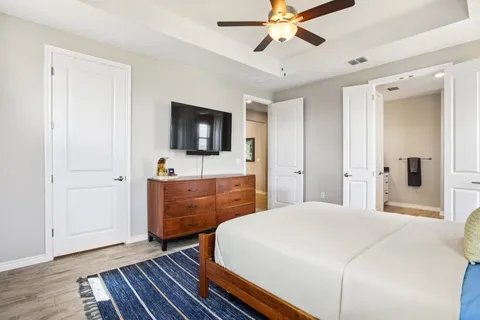 a bedroom with bed and a night stand