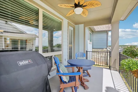 a view of a balcony with furniture