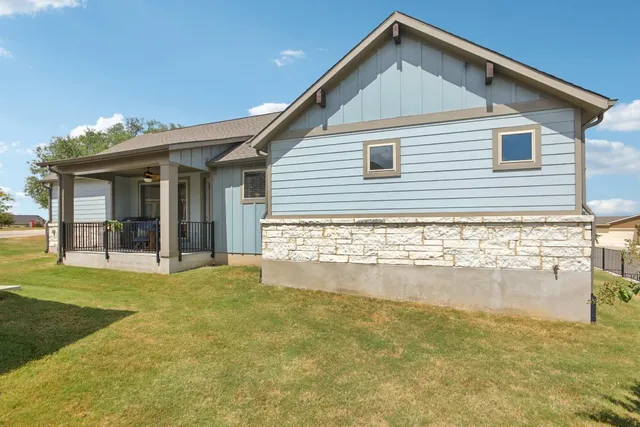 a view of a chair and tables in the balcony