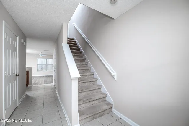 a kitchen with a stove sink and cabinets