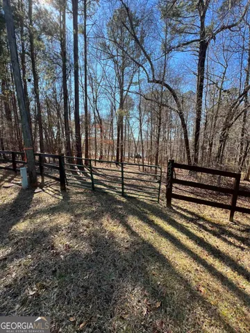 a view of outdoor space with deck and tree