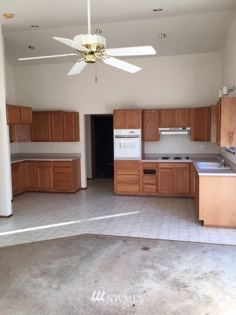 159 Yakima Avenue Southeast Renton, WA 98059 - Photo 18 of 19 a view of kitchen with furniture and wooden floor