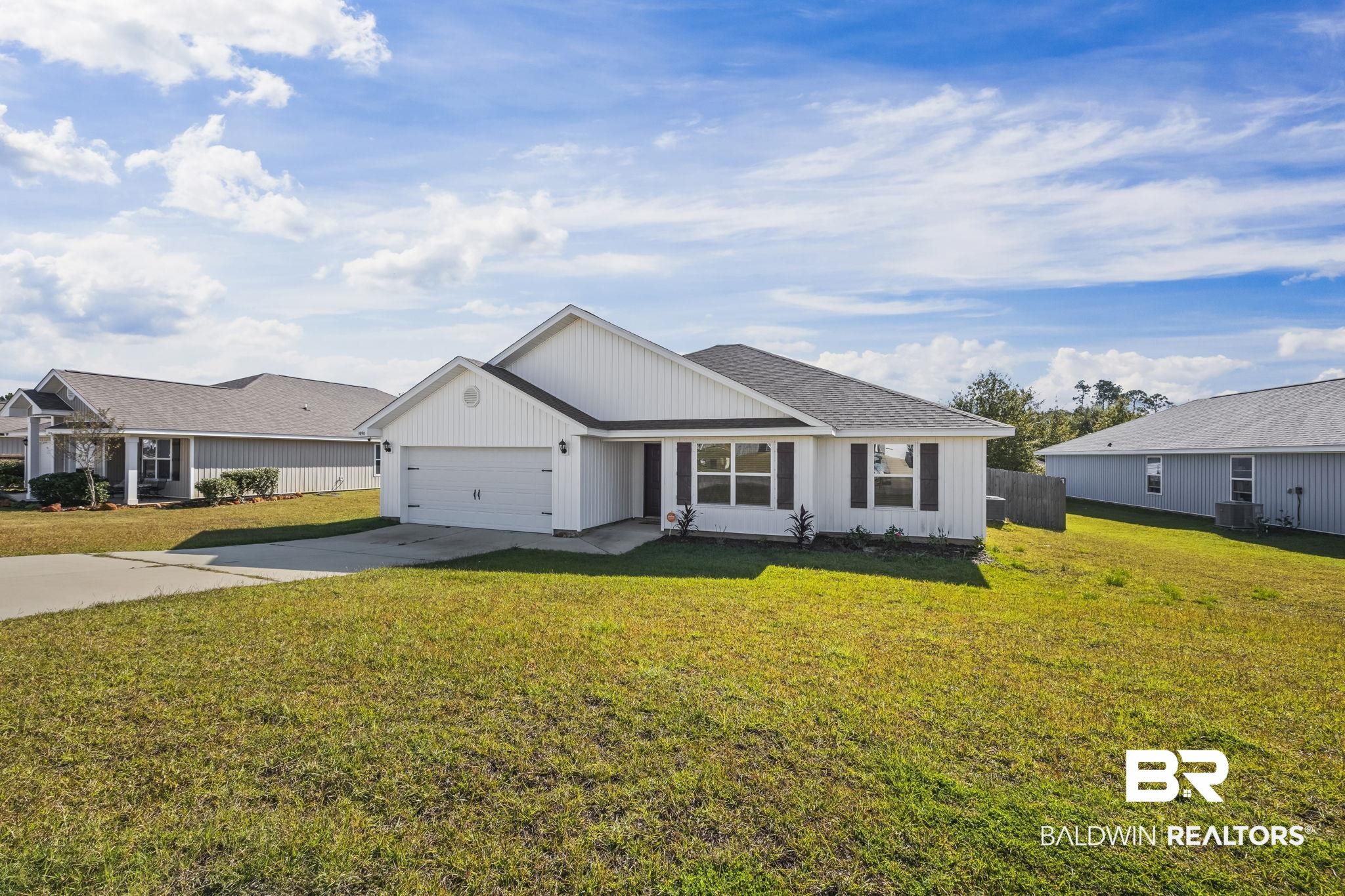 3090 Camino Real Loop Lillian, AL 36549 - Photo 2 of 29 View of front facade featuring driveway, an attached garage, and roof with shingles