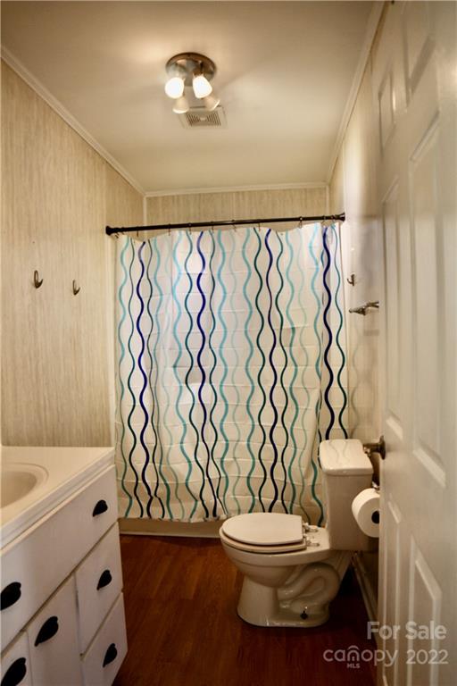 4197 Renee Ford Road Stanfield, NC 28163 - Photo 11 of 23 a bathroom with a toilet and a shower curtain