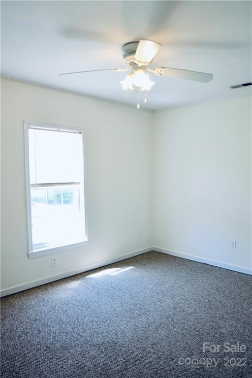 4197 Renee Ford Road Stanfield, NC 28163 - Photo 12 of 23 an empty room with a window