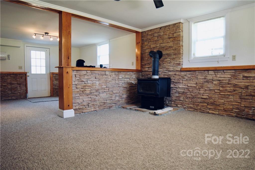 4197 Renee Ford Road Stanfield, NC 28163 - Photo 17 of 23 a view of an empty room with windows & cabinet
