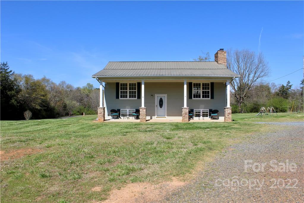 4197 Renee Ford Road Stanfield, NC 28163 - Photo 2 of 23 a front view of a house with a yard