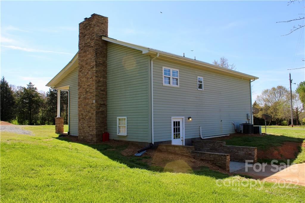 4197 Renee Ford Road Stanfield, NC 28163 - Photo 4 of 23 a view of a backyard with a garden
