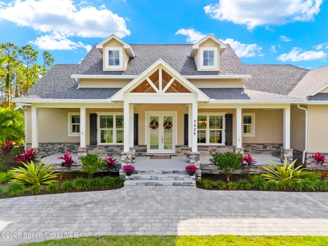 a front view of a house with yard
