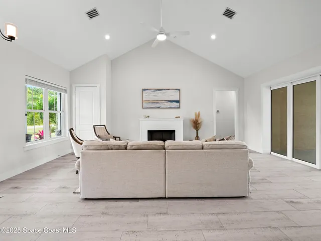 a living room with furniture and a table